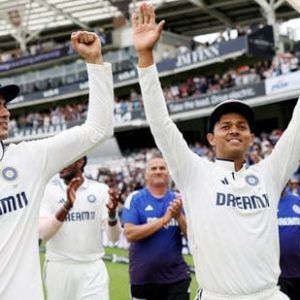 Indian cricketers celebrate victory at Lord's with raised arms and bat